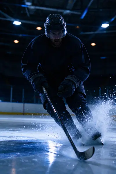 Hockey players racing for the puck on the ice, a live game on AirnTV